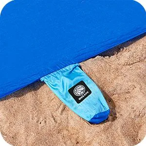 WEKAPO Beach Blanket Sandproof, Extra Large Beach Mat, Big & Compact Sand Free Mat Quick Drying, Lightweight & Durable with 6 Stakes & 4 Corner Pockets Blue 9x10 FT (18 person) - compact storage beach mat