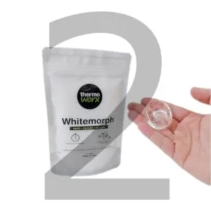 Thermoworx Whitemorph 2.2lb. Hand moldable bioplastic. Melt, Mold and Reuse - whitemorph pack with hand containing melted pellets