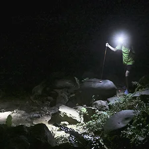 Nitecore NU33 Rechargeable Headlamp, 700 Lumen USB-C White, Red and Reading Lights, with Lumen Cable Organizer - Hiker at night lighting path with NU33