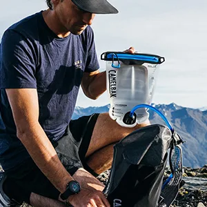 CamelBak Fusion Reservoir with TRU Zip Waterproof Zipper - Leak-Proof Hydration Bladder 3L - Man with hydration bladder with zipper.
