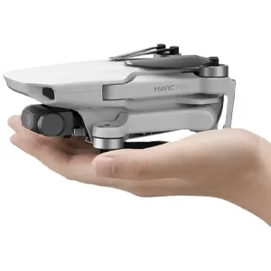 DJI Mavic Mini Combo Drone FlyCam Quadcopter with 2.7K Camera 3-Axis Gimbal GPS 30min Flight Time (Renewed) - Mavic Mini held in palm of hand