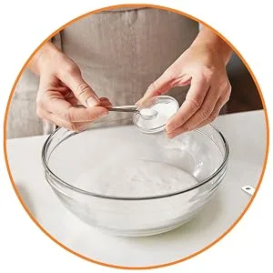 Elmer's Liquid School Glue, Washable, 1 Gallon, 2 Count 1 Gallon - 2-count Glue - Person adding baking soda to glue