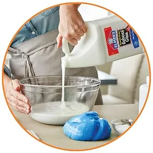 Elmer's Liquid School Glue, Washable, 1 Gallon, 2 Count 1 Gallon - 2-count Glue - Person adding glue to bowl