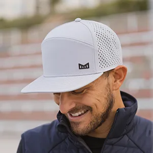 melin Trenches Icon Hydro, Performance Snapback Hat, Water-Resistant Baseball Cap for Men & Women X-Large Black - man wearing hat