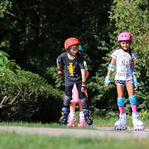 Roller Derby ION 7.2 Inline Skates with Aluminum Frames and Adjustable Sizing for Growing feet Small (11-1) - Kids skating outdoors