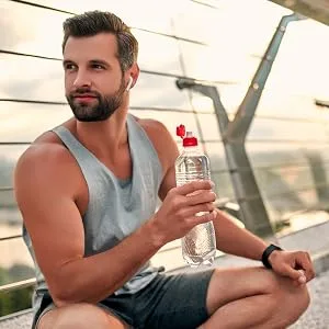 Horb ach Mens Multivitamin | 60 Caplets | Advanced Formula | with Vitamin C D Magnesium Minerals & More | Non-GMO & Gluten Free Supplement - Man drinking water sitting down