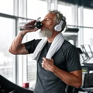 Horb ach Mens Multivitamin | 60 Caplets | Advanced Formula | with Vitamin C D Magnesium Minerals & More | Non-GMO & Gluten Free Supplement - Man drinking water while running
