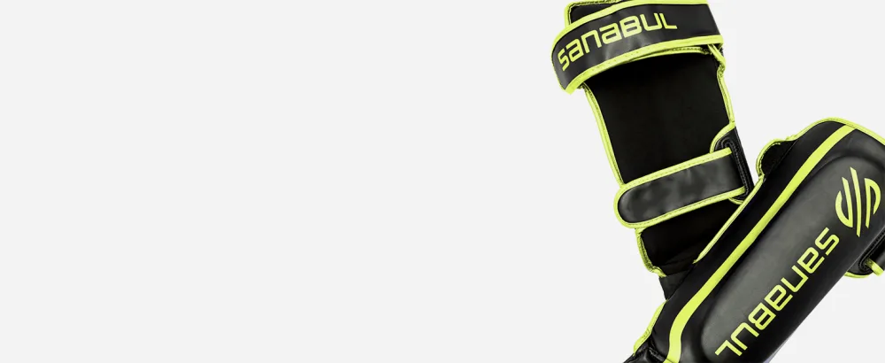 Sanabul Essential Hook and Loop Strap Kickboxing Muay Thai MMA Shin Guards Black S/M - Essential Kickboxing MMA shin guards with hook and loop straps