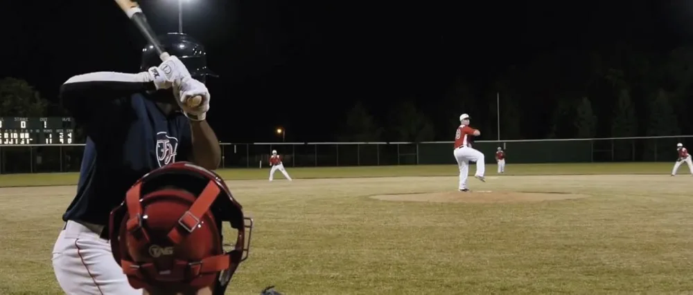 TAG Zone Home Plate - baseball players on field at night