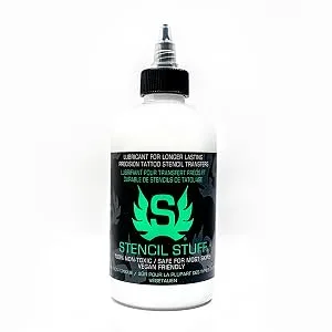 Stencil Stuff 4 Ounce - Clear Stencil Stuff bottle front with black label and cap filled with white solution