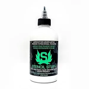 Stencil Stuff 4 Ounce - Clear Stencil Stuff bottle front with black label and cap filled with white solution