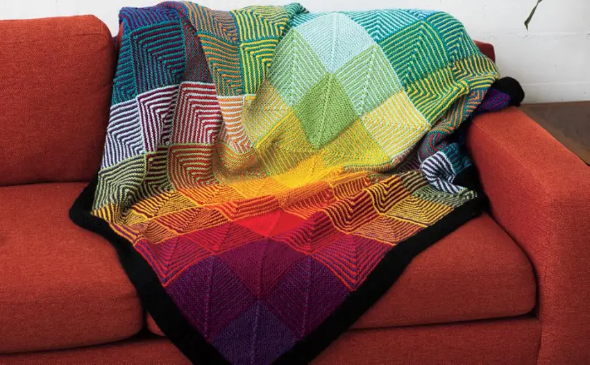 Knit Picks Hue Shift Afghan Knitting Pattern Kit (Rainbow) - The Hue Shift afghan displayed on a couch