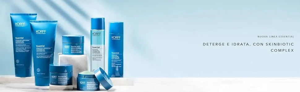 Korff Perfecting Powder reduces shine transparent soft-focus effect matte finish 10g - Collection de contenants bleus de soins de la peau ou de produits cosmétiques disposés sur fond blanc.