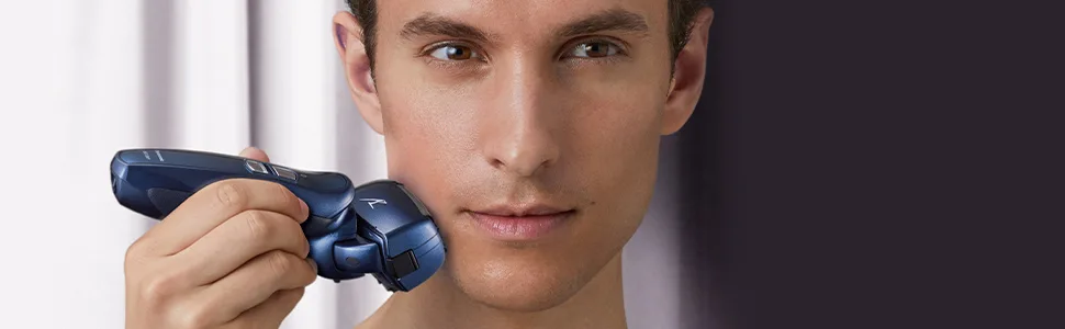 Panasonic Shaver Replacement Outer Foil and Inner Blade Set WES9025PC  Compatible with ARC4 4-Blade Shaver ES-LA63AA  ES-LA63-S - caucasian man shaving his cheek with Panasonic ES-LA63AA cordless electric shaver