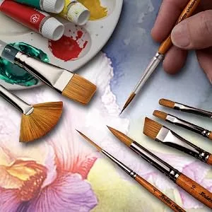 Silver Brush Limited 2007S Golden Natural Script Liner Brush for Watercolor  Oil  and Acrylic  Size 4  Short Handle - A hand holding a fine-tipped paintbrush beside artistic brushes and a paint palette.
