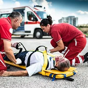Dixie EMS First Responder Fully Stocked Trauma First Aid Kit   Orange - emt on roadway