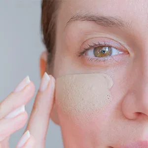 CONTROL CORRECTIVE Tinted Moisturizer With Spf 30  2.5 Oz - Non-Greasy Hydration  Subtle  Healthy-Looking  Even Out Skin Tone  Moisturizes & Protects  Zinc  Titanium  Natural Sunscreen  Sheer Coverage - Woman applying tinted moisturizer