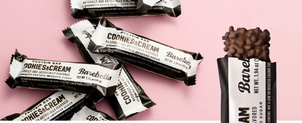 Barebells Protein Bars - Protein Snacks with High Protein - Chocolate Protein Bars - Perfect on The Go Protein Snack & Breakfast Bars (12 Count (Pack of 2) Cookies and Cream) - Feed your cravings banner Barebeells Cookies and Cream