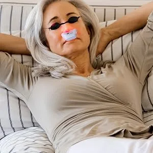 Red Light for Nose Red Light Nasal - Model wearing eye protection and red light nose probes device for nasal therapy.
