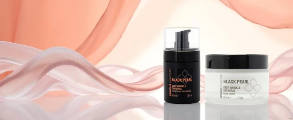Black Pearl Deep Wrinkle Decrease Face and Neck Skin Moisturizing Duo - Facial Cream 1.7 oz and Treatment Serum for Face 1 oz - Hydrate Brightening Long Term Repair - image of black pearl face cream and serum duo with pink silk drapery in background