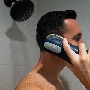 Griffin Water-Powered Ear Cleaner Safe Gentle Earwax Removal System with Adjustable Pressure & Reusable Tips for Comfortable Hygiene Care (Includes 6 Replacement Nozzle Tips USB-C Charging Cord). - man using griffin ear cleaner in shower