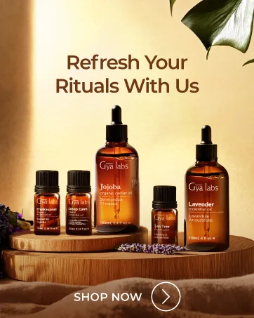 Gya Labs Fortune Essential Oil Blend - Uplifting & Inviting (0.34 Fl Oz) - Text reads 'Refresh Your Rituals With Us' and ''. Product display of amber glass bottles with skincare products on wooden surface with warm lighting.