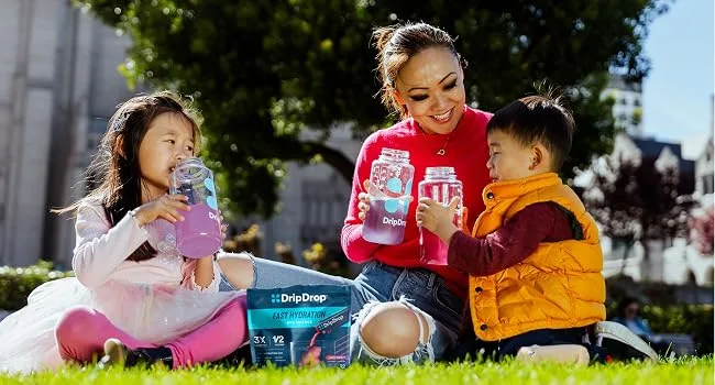 DripDrop Hydration Packets - Bold Variety Pack - Single Serve Electrolytes Powder Drink Mix - Watermelon Berry Lemon Orange - Non-GMO Gluten Free Vegan - 80 Sticks - Woman and family drinking DripDrop