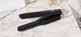 ghd Dramatic Ending - Smooth & Finish Serum  1 fl. Oz. - ghd unplugged cordless styler on white granite counter