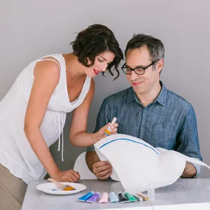 Pearhead Belly Cast Decorating Kit  Multi Belly Casting Decorating Kit - Image of expecting mother and father decorating belly cast