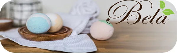 Bela Luxury Bath Bombs  Assorted Fragrances  Three Piece Gift Tube - Huge 4.5 Oz - Bela Bath Bombs on wooden dish with towel with Bela logo.