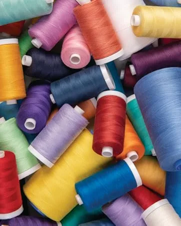 Connecting Threads 100% Cotton Thread - 1200 Yard Spool (Red) - a pile of colorful spools of thread