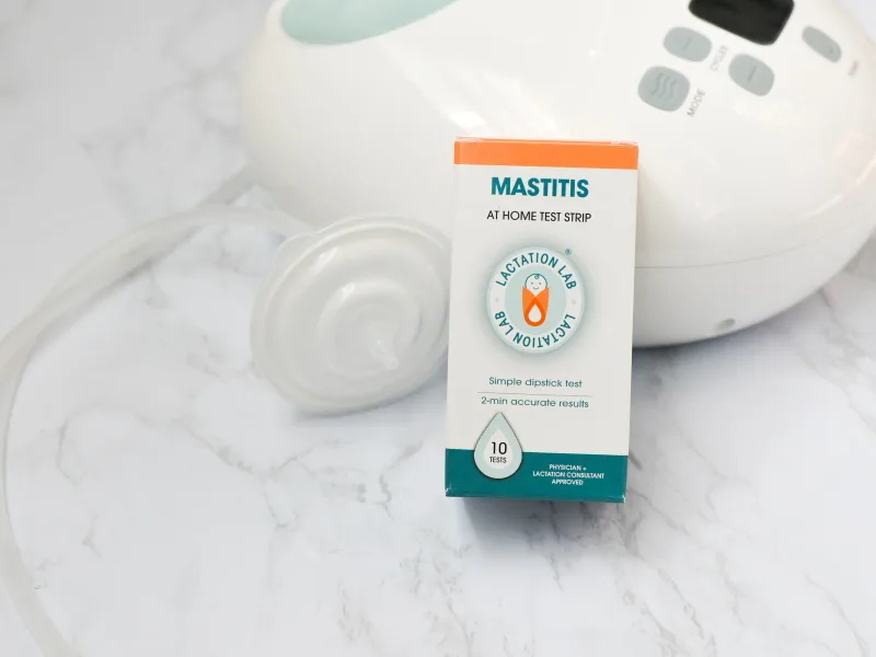 Lactation Lab Mastitis Test Strips. at-Home Test for Breastfeeding Moms. 10 Test Strips - Mastitis test kit box with breast pump in background