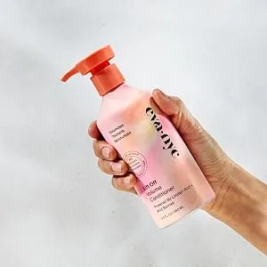 Eva NYC Lift Off Volume Conditioner  8.8 oz - hand holding lift off volume conditioner bottle