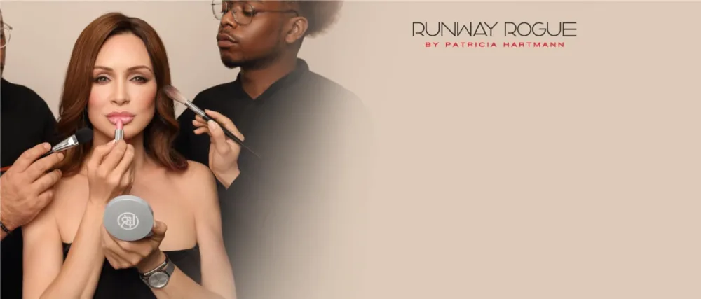 Runway Rogue Designer Liner Lip Pencil  Matte Raspberry Lip Liner and Sharpener  Open Call - Patricia Hartmann putting on lipstick next to the Runway Rogue logo.