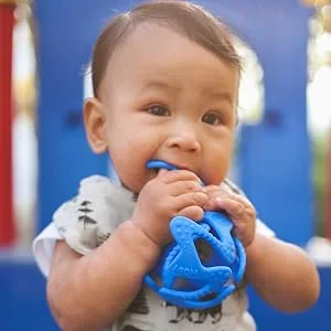Nuby 100% Silicone Tuggy Teether Ball  6 Months +  Colors May Vary 1 Count (Pack of 1) multi - blue