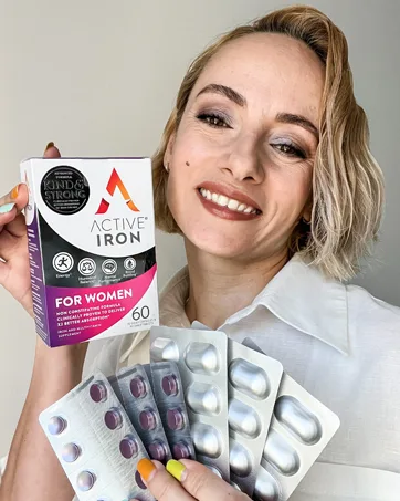 Active Iron High Potency Iron Supplement 2X Better Absorption & Non-Constipating Helps Support Energy Iron Pills for Women & Men 25mg (60 Capsules) - Woman holding box of Active Iron and blisters