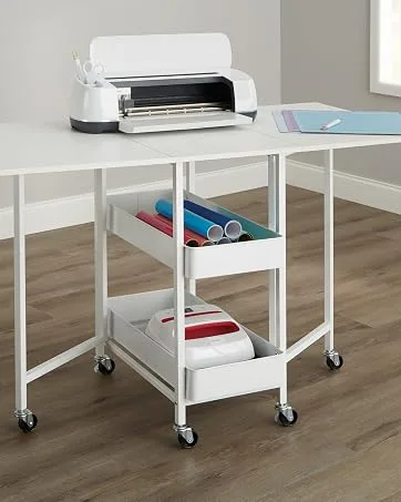Michaels 12 x 12 Scrapbook Case by Simply Tidy  - A desk with a craft machine on top