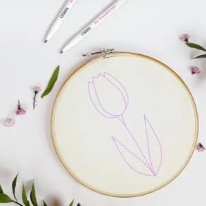 LEONIS Disappearing Ink Fabric Marking Pen Pink 5 Count Pack 78009  - flower pattern drawn on canvas with disappearing ink pen in bright purple color