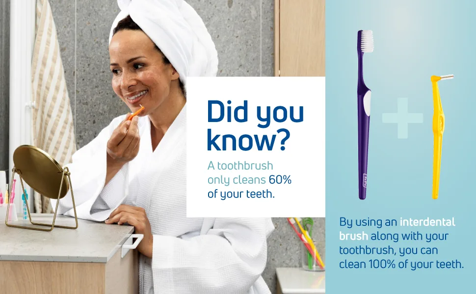 TEPE Interdental Brush Angle Angled Dental Brush for Teeth Cleaning Pack of 25 0.7 mm Medium Gaps Yellow Size 4 Yellow - 0.7 Mm - A Black woman in a white robe using a TePe interdental brush and toothbrush to clean between teeth.
