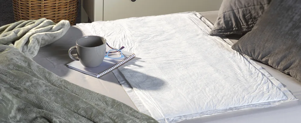 Depend Underpads (Formerly Bed Protectors) for Incontinence Disposable 36"x 21" Slip Resistant Overnight Absorbency 24 Count (2 Packs of 12) (Packaging May Vary) - Night Defense Underpads