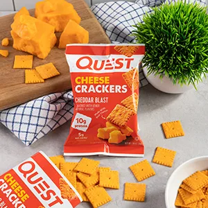Quest Nutrition Cheese Crackers Cheddar Blast High Protein Low Carb Made with Real Cheese 12 Count (1.06 oz bags) - Cheese Crackers on a board