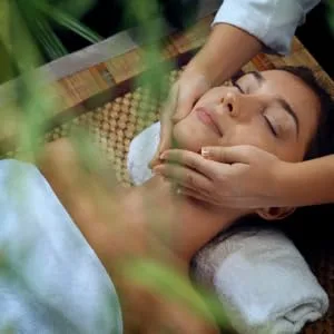Absolute Aromas Organic Carrier Oils Set with Sweet Almond Sunflower and Apricot Kernel 3 x 100ml in Glass Bottles - woman getting a face massage