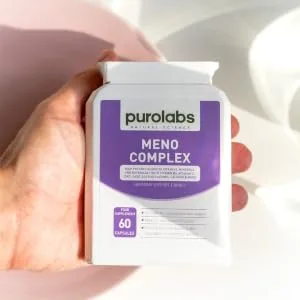 Menopause Complex Supplement - Natural Relief for Hot Flushes & Night Sweats - Menopause Vitamins for Women - 60 Capsules - Made in The UK - A hand holding purolabs meno complex bottle