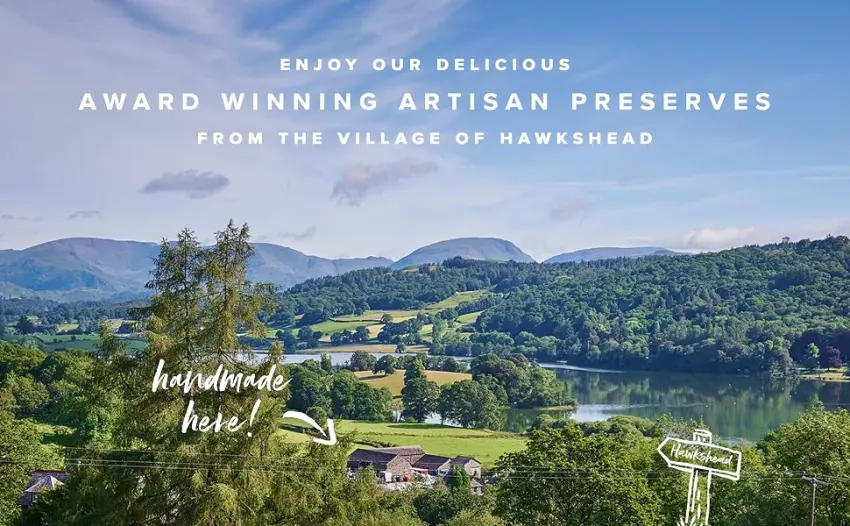 Hawkshead Relish - Hot Beetroot Ketchup 285g - A landsacpe with trees, hills and a lake. A lone building sits in the foreground.