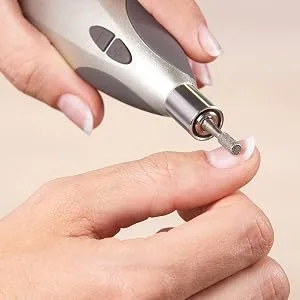 Beurer MP 60 Manicure Pedicure Tool Set with 9 Sapphire and Felt Tips for Hand and Foot Care - MP 60 replacement set closeup application on the thumb