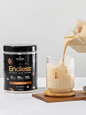 Protein Works - Endless Coffee | for Brain and Cognitive Support | Zero Crash No Added Sugar | Caramel Latte - 460g - pouring endless coffee from a carton into the glass with ice