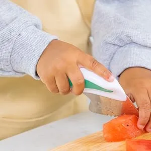 Doddl Knife for Toddler Cooking and Mealtimes Learning to Use Cutlery (Aqua) - chopping close up