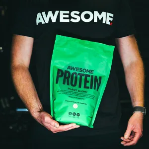Chocolate Nut Awesome Protein Powder by Ben Coomber | 1kg Vegan Organic Flavoured Protein | 33 Servings Low-Calorie Plant-Based Chocolate Nut Protein Powder - Man holding protein